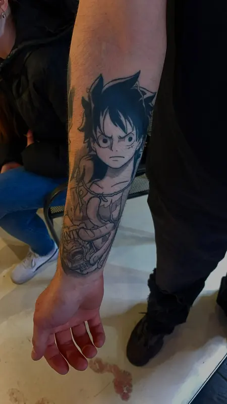 Anime-tattoo op de onderarm